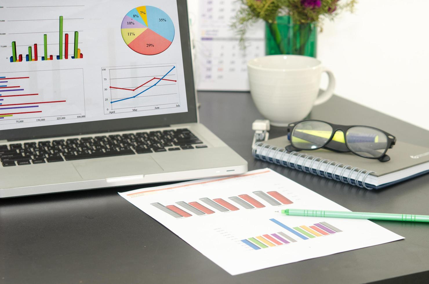 Computer And Graph On Desktop Free Photo